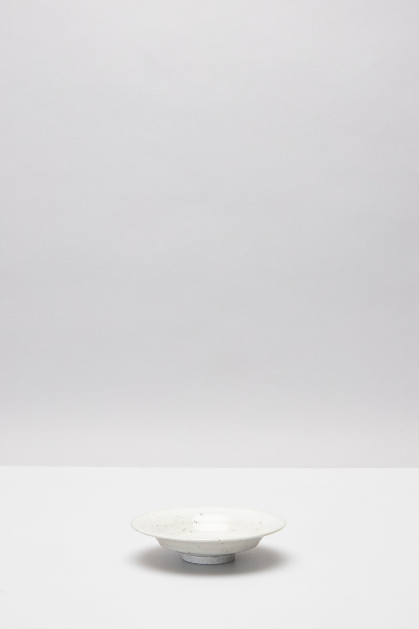 馬場 光二郎｜白磁４.５寸反り皿｜CURVED RIM PLATE